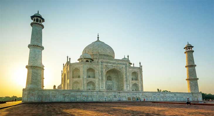 Taj Mahal at sunrise reflected in the central pool — the world's greatest monument to love, Agra India