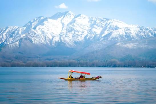 Couple enjoying a romantic shikara ride on Dal Lake in Kashmir