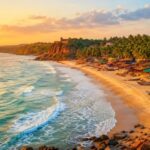 Aerial view of Goa's coastline with palm trees and beach