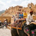 Children enjoying an elephant ride at Amber Fort, a Golden Triangle family tour highlight