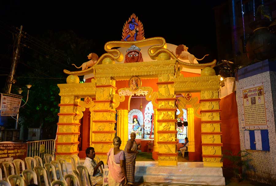 Decorated Kali Puja pandal lit at night in Kolkata